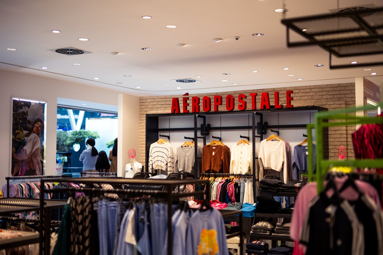 programs-03 Modern Aéropostale store interior showcasing fashionable clothing and accessories on display.