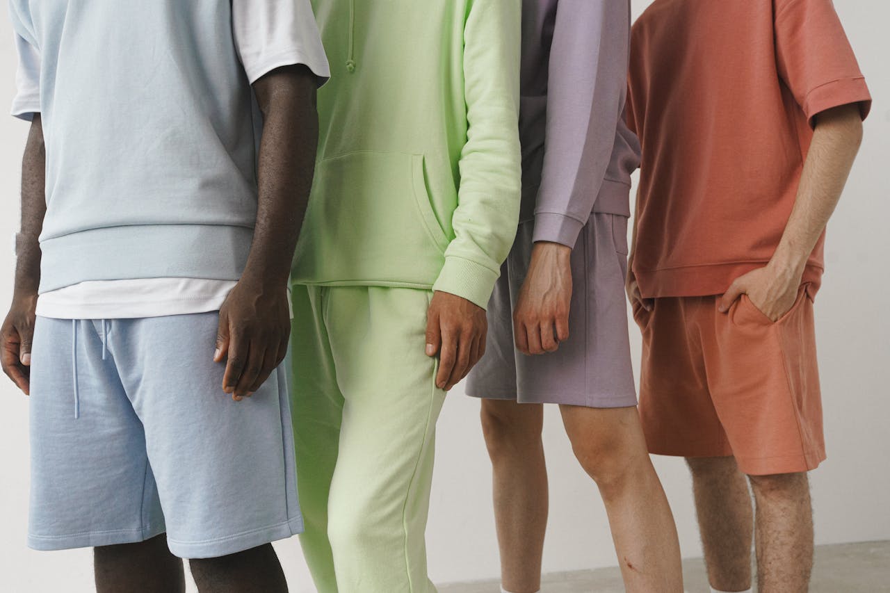 hero-gallery-04 A close-up image showcasing a variety of pastel-colored men's fashion sweatshirts and shorts.